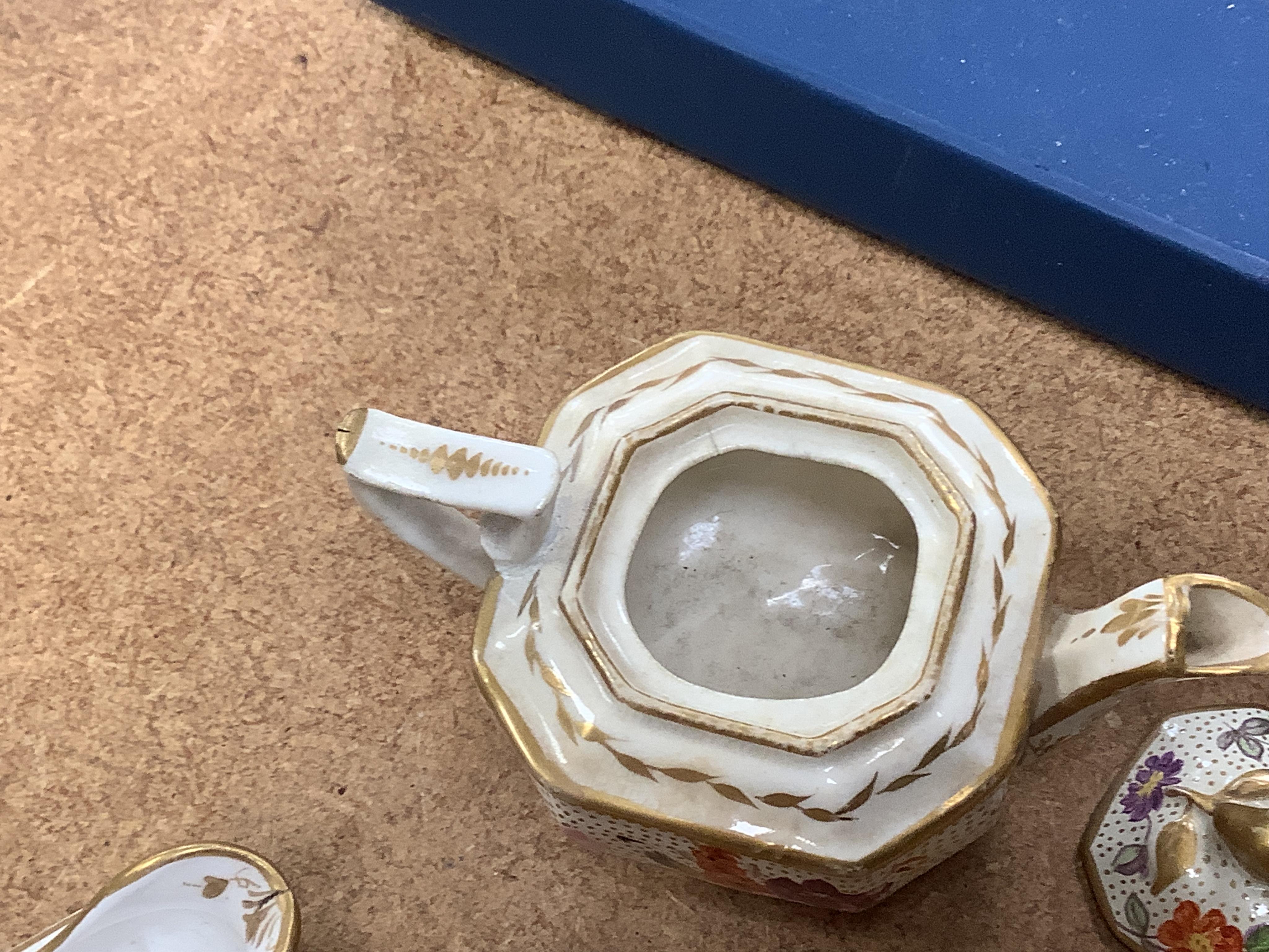 A pair of Meissen Marcolini period floral custard cups & covers together with an early 19th century English porcelain miniature tea set on tray, largest 20cm wide